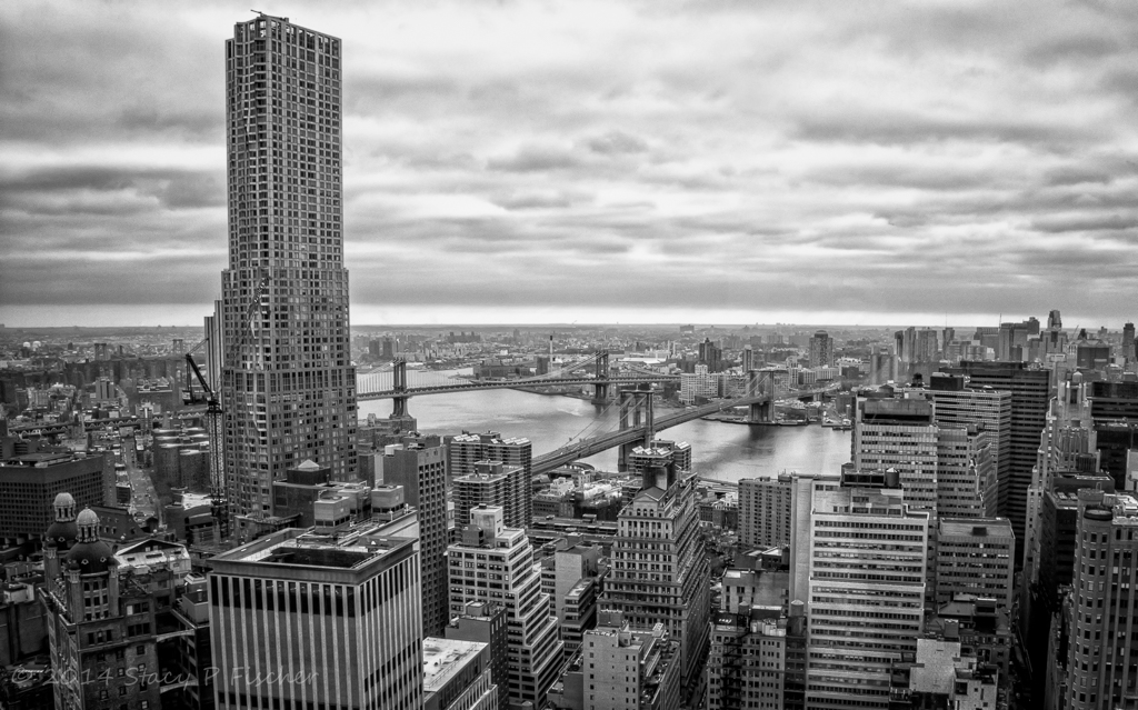 Skyline, Manhattan and Brooklyn Bridges span the East River connecting Lower Manhattan to Brooklyn