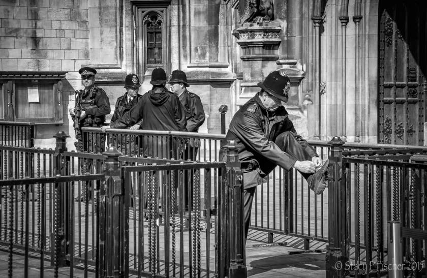 London Bobby tying shoe