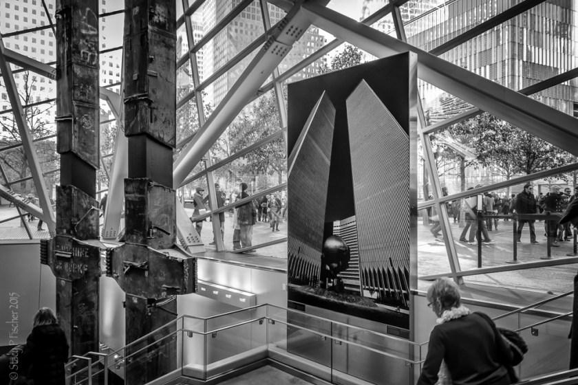9/11 Memorial Museum entrance with photo of World Trade Center Towers and tridents