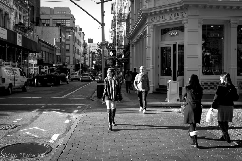 SoHo pedestrians illuminated by sidelight