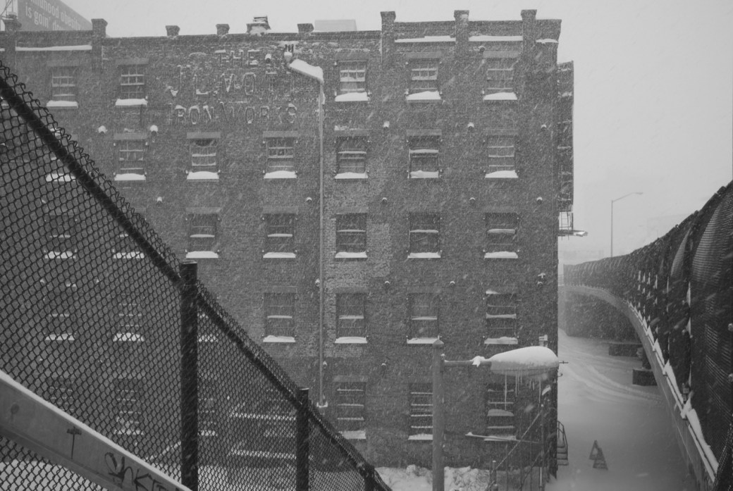 Bronx building and bridge with snow