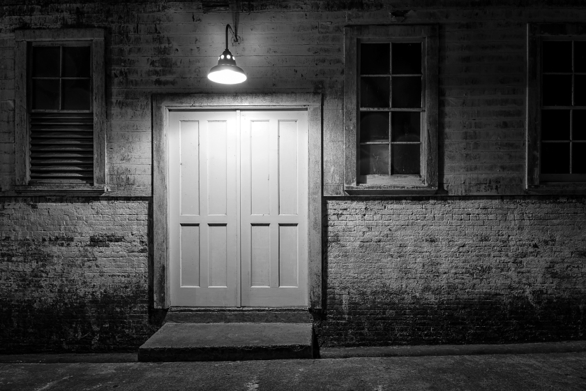 Door at Alcatraz lit at night