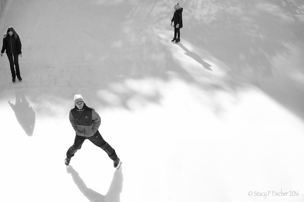 Ice skaters and their shadows