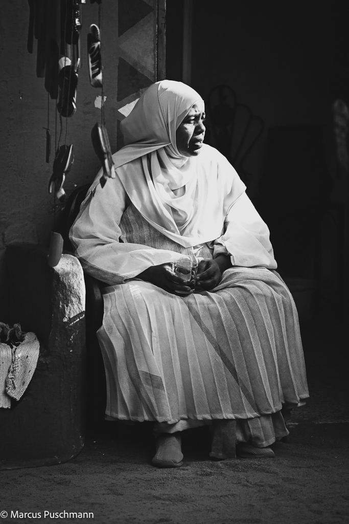 Nubian woman wearing traditional clothes enjoying a moment of silent observations